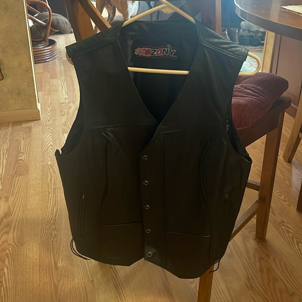 Leather vest no size but fits me fine and I am large